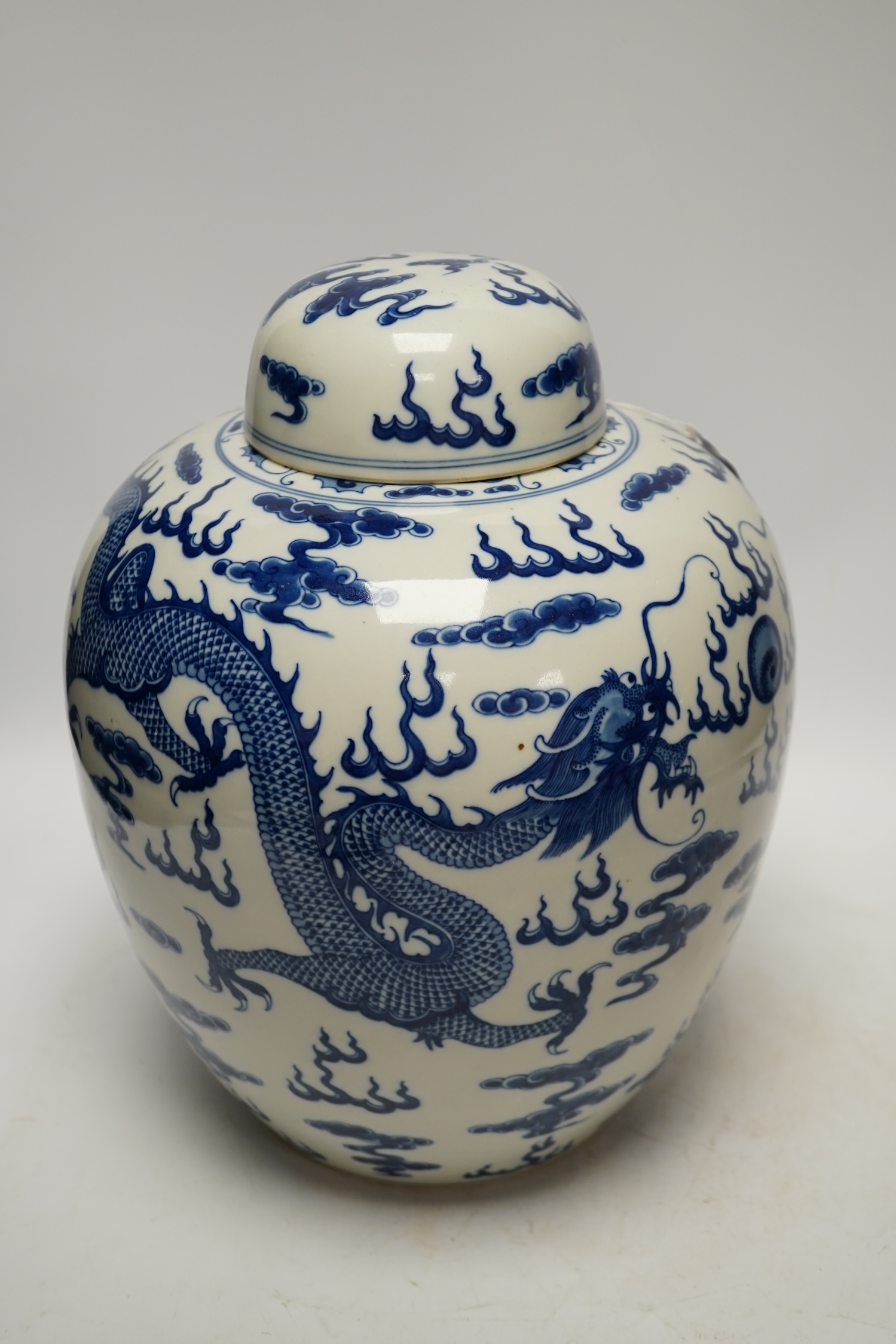 A large Chinese blue and white ‘dragon’ ginger jar and cover, 32cm